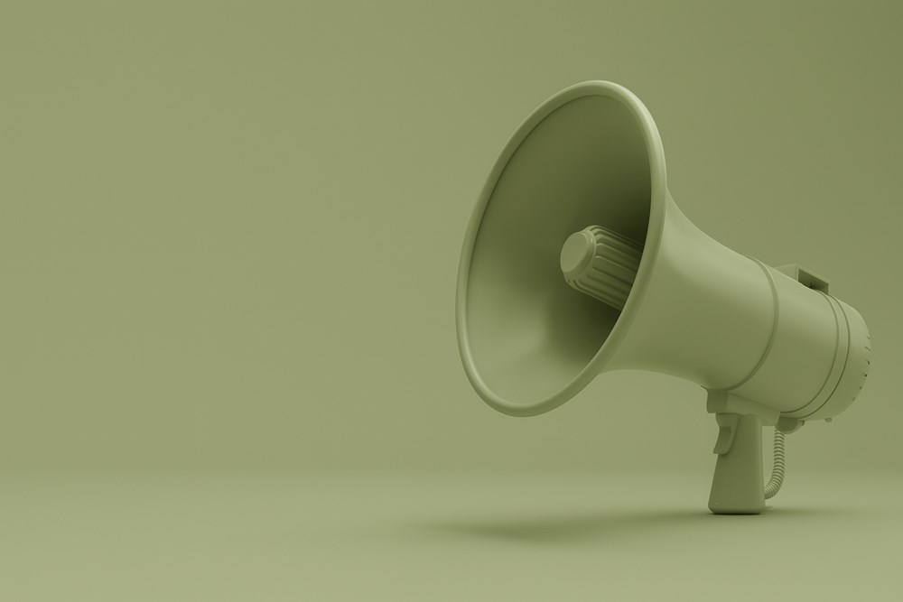 Green megaphone and green background.